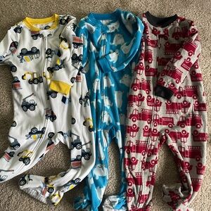 Bundle of 3 Carter's footed pajamas. 24 months